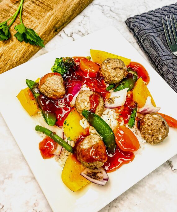 13 Sweet & Sour Meatballs, Veggies over Rice & Bun.
